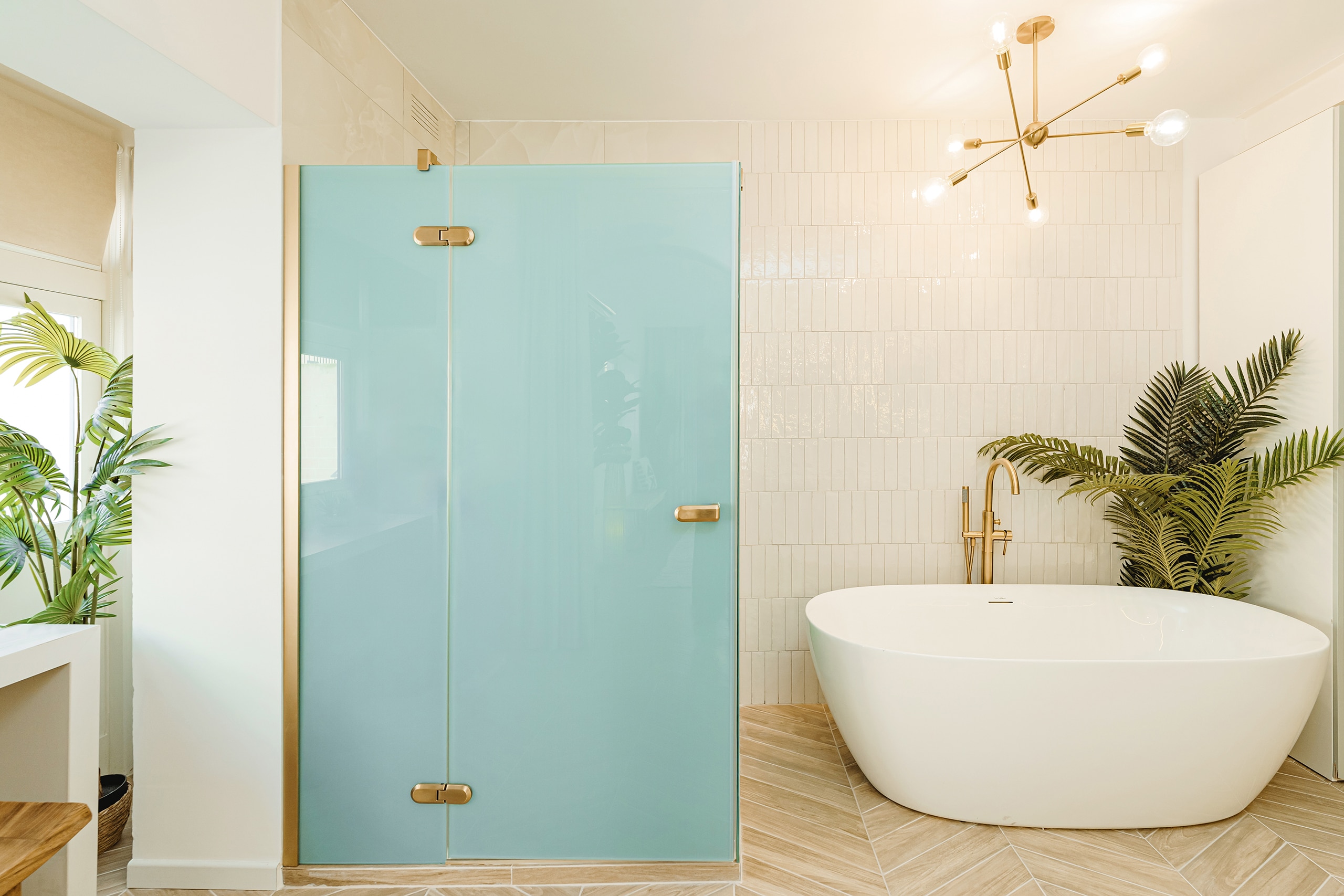 Bathroom with freestanding bathtub and glass shower