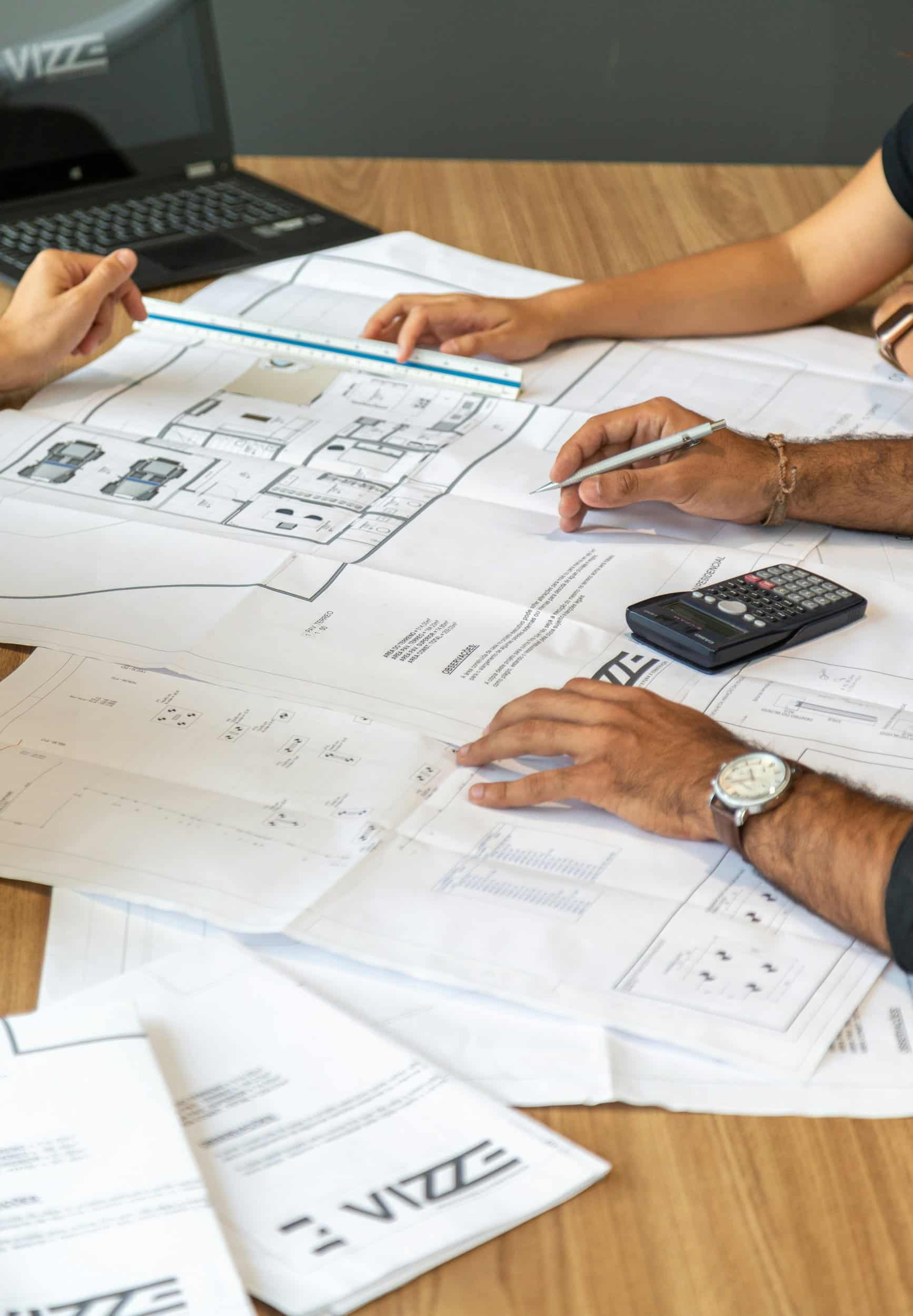 Architectural plans laid out on a desk