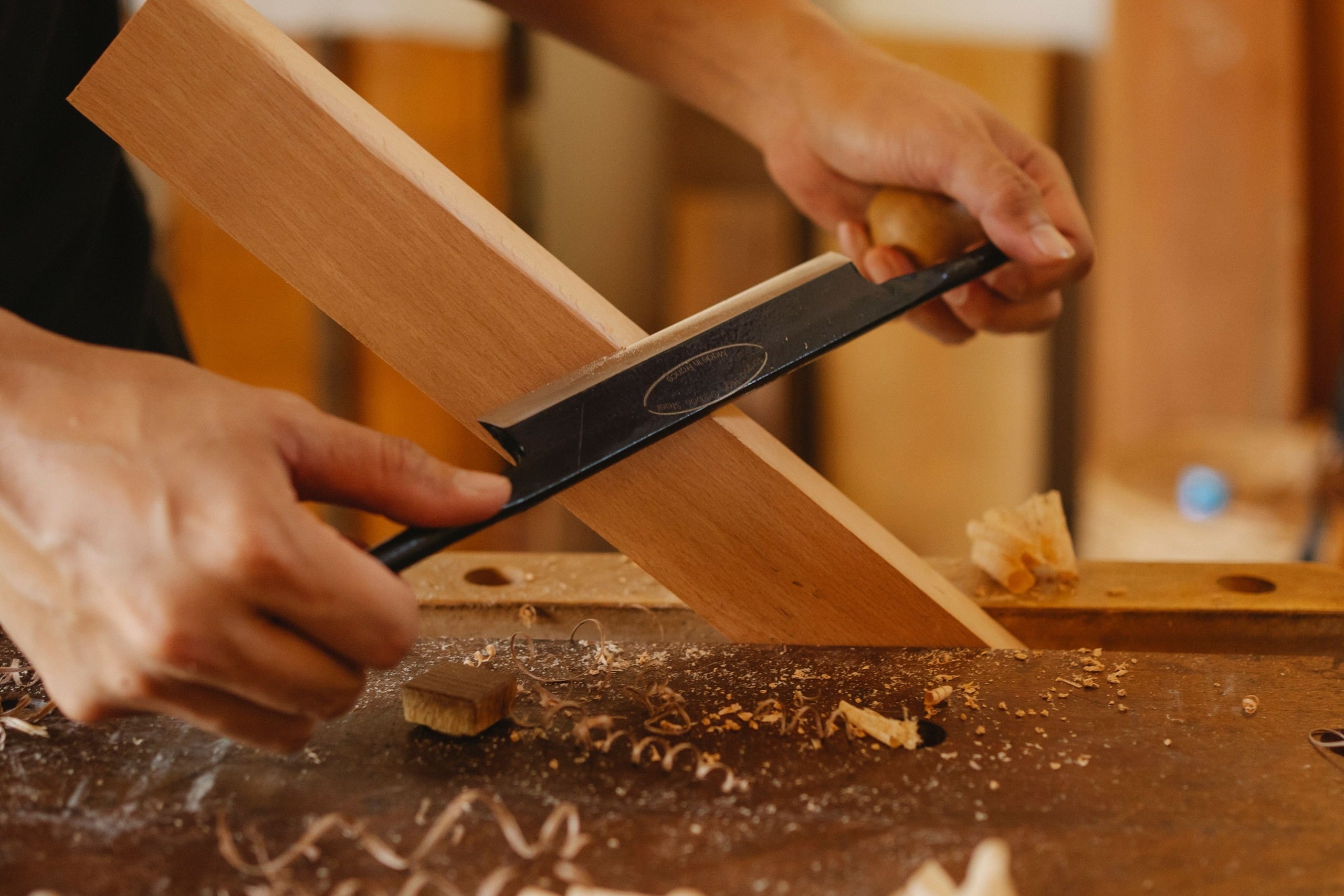 Craftsman planing timber in the JoinwellFXB workshop